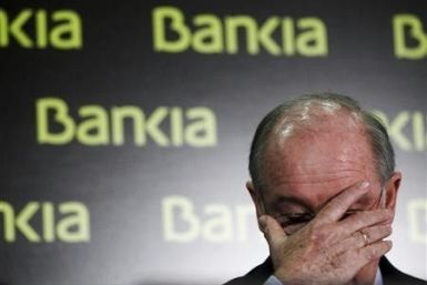 U.S. investors came back from a long holiday weekend to a flurry of big news from Spain Tuesday, as the government there is looking to stave off the imminent collapse of nationalized financier Bankia S.A. -- the country's fourth-largest bank -- with a €19