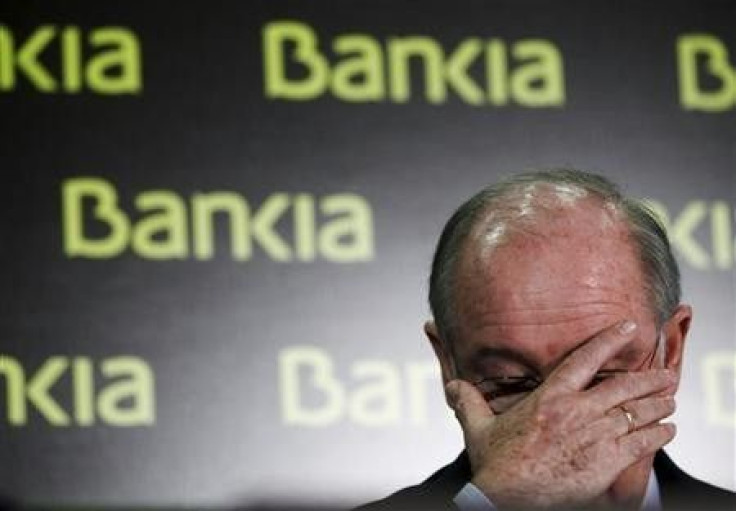 U.S. investors came back from a long holiday weekend to a flurry of big news from Spain Tuesday, as the government there is looking to stave off the imminent collapse of nationalized financier Bankia S.A. -- the country's fourth-largest bank -- with a €19