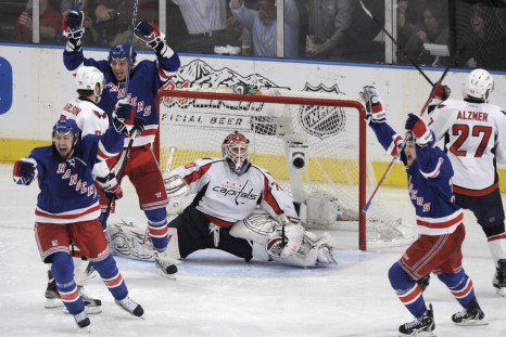 The Rangers celebrate after scoring the overtime winner in game five. The Rangers take on the Capitals at 7:30 p.m. ET.