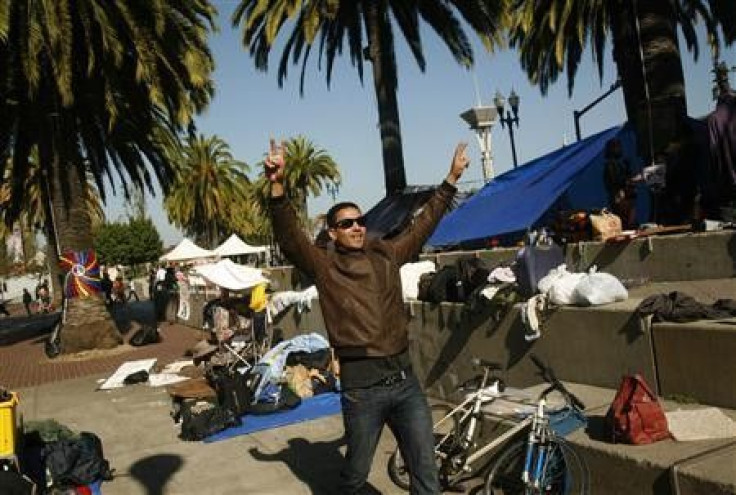A man gestures at an encampment of Occupy San Francisco protesters at the Justin Herman Plaza in San Francisco, California