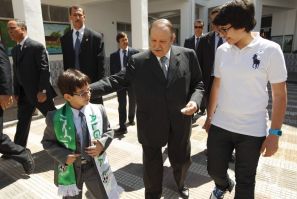 Algeria&#039;s president Bouteflika walks with nephews after casting ballot during parliamentary elections in Agiers
