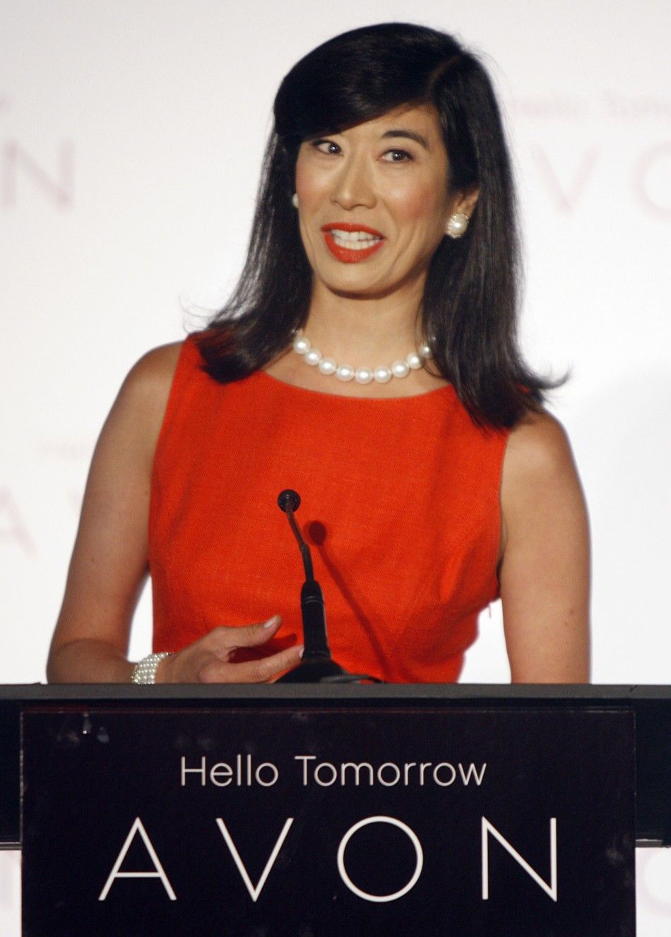 Andrea Jung, chairman and CEO of Avon Products, Inc., announces that actress Reese Witherspoon will serve as Avons first ever Global Ambassador during a news conference in Beverly Hills, California August 1, 2007.