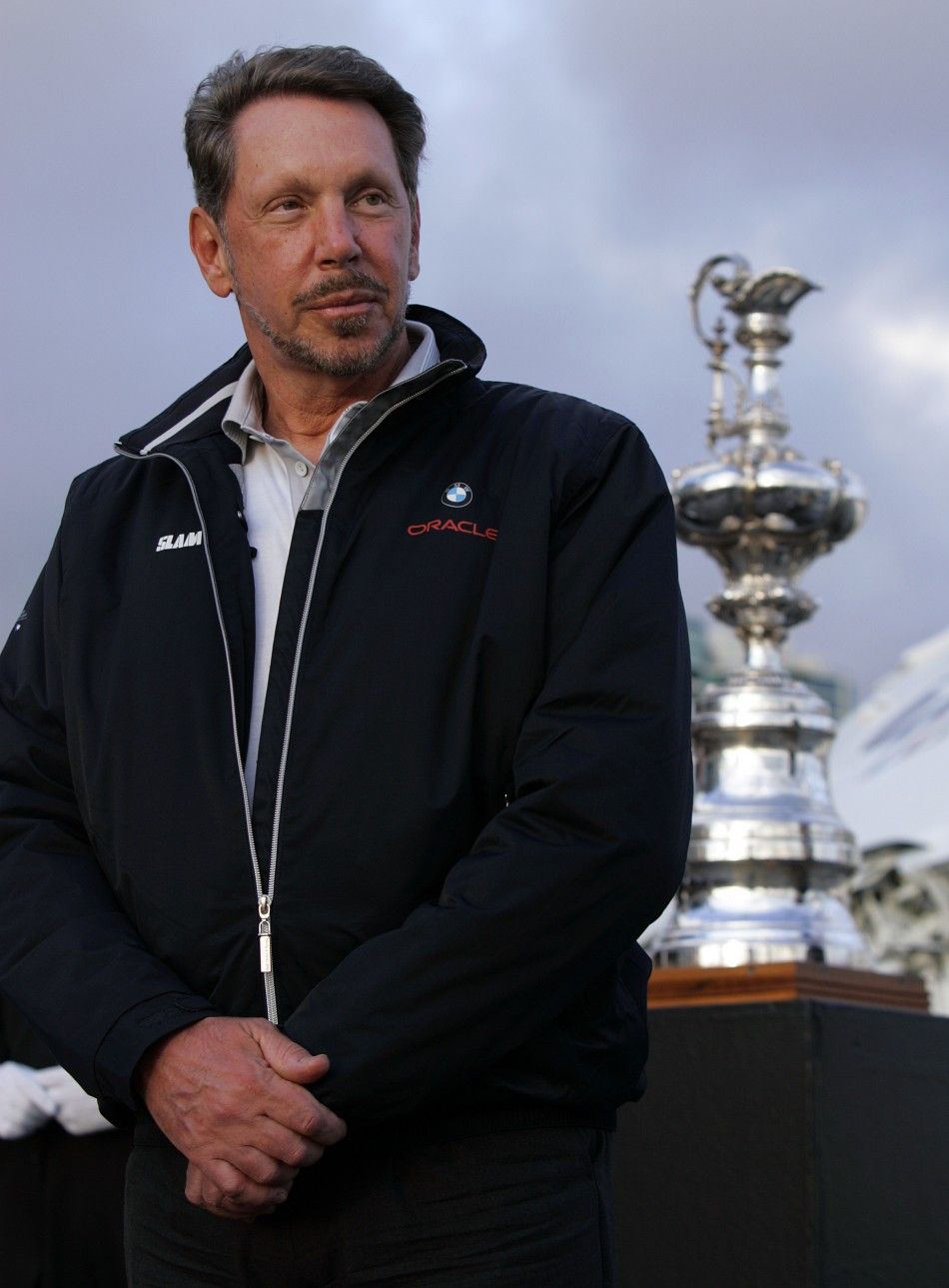 Larry Ellison, owner of BMW Oracle, winner of the 33rd Americas Cup, stands next to the Americas Cup on the USS Midway in San Diego, California February 21, 2010.