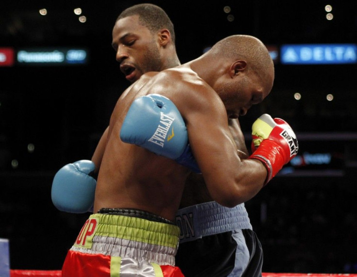 Bernard Hopkins (L) gets tangled up with Chad Dawson