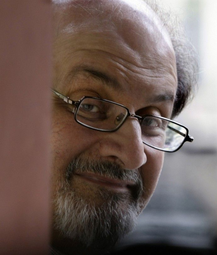 British author Salman Rushdie poses for photographers during a photocall before his news conference at Asia house in Barcelona April 1, 2009. 