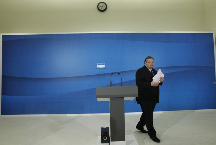 Socialist PASOK party leader Venizelos walks towards the exit after a news conference at the parliament in Athens