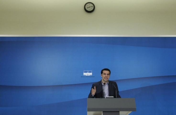 Greece&#039;s Left Coalition party head Tsipras addresses reporters during a news conference after a meeting with Socialist PASOK party leader Evangelos Venizelos at the parliament in Athens