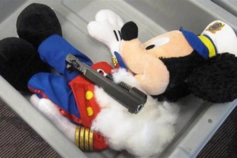 Smuggling Pistol in Mickey Mouse Doll