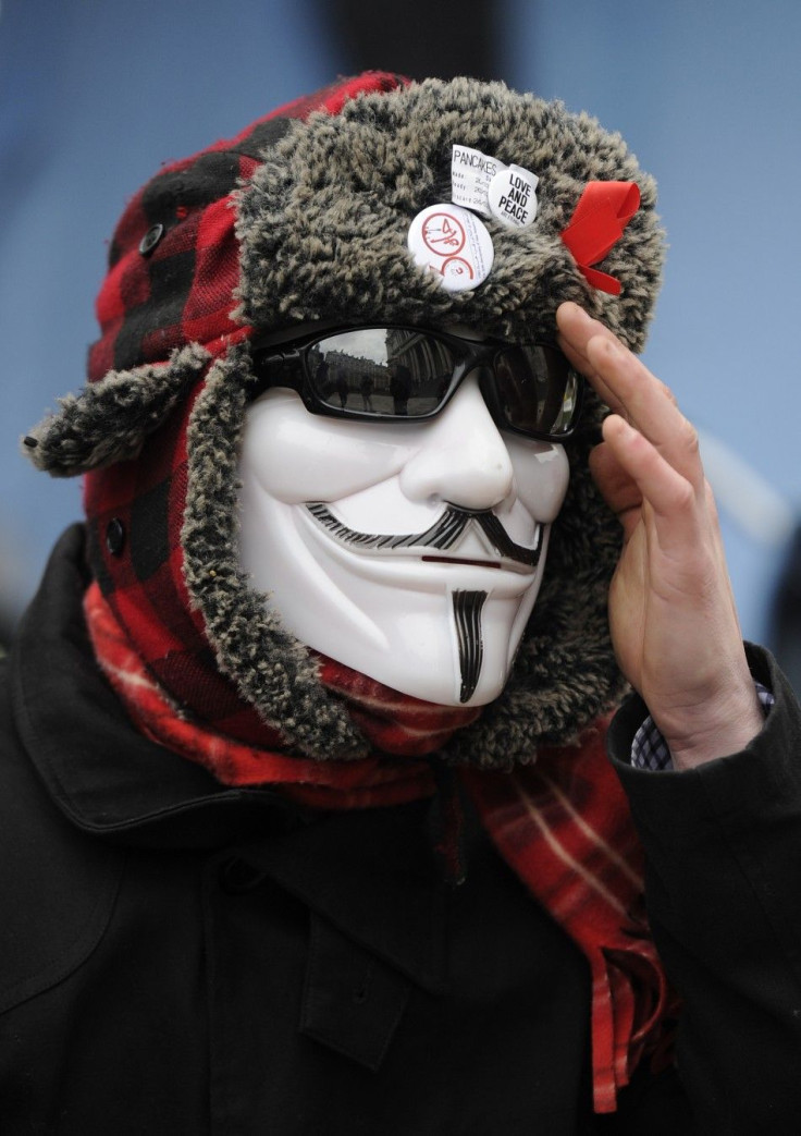 A member of the Occupy London protest camp gestures outside St Paul's Cathedral in London February 22, 2012.