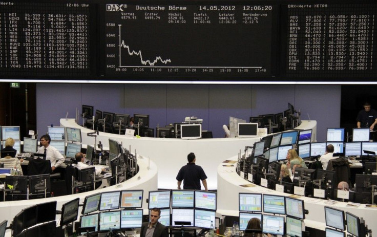 Traders work the floor of the Frankfurt Stock Exchange