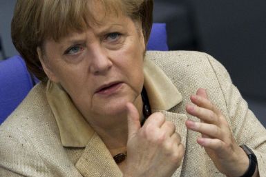 German Chancellor Merkel attends a debate after delivering statement on her government policies in Berlin