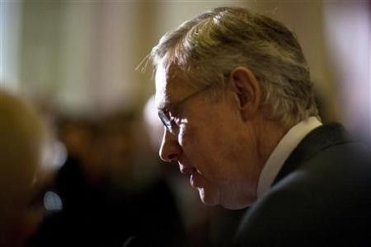 Senate Majority Leader Harry Reid speaks to the media after the U.S. Senate passed a bill allowing a rise in the debt ceiling on Capitol Hill in Washington