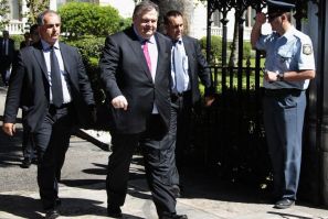 Socialist leader Evangelos Venizelos leaves the Presidential Palace after a meeting in Athens