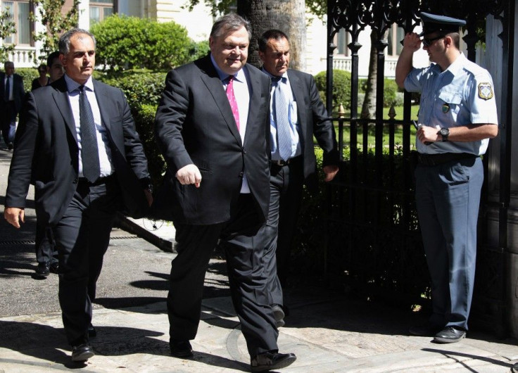 Socialist leader Evangelos Venizelos leaves the Presidential Palace after a meeting in Athens