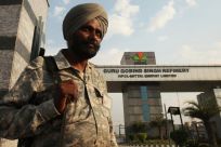 An Indian security personnel stands guard in front of the main entrance of the Guru Gobind Singh oil refinery near Bhatinda