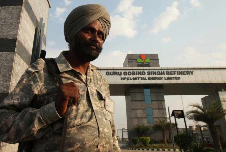 An Indian security personnel stands guard in front of the main entrance of the Guru Gobind Singh oil refinery near Bhatinda