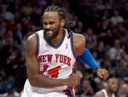 New York Knicks center Ronny Turiaf celebrates a score against the San Antonio Spurs in the first quarter of their NBA basketball game at Madison Square Garden in New York, January 4, 2011.