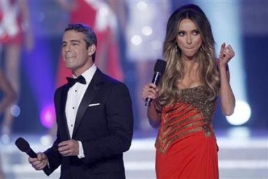 Andy Cohen (L) and Giuliana Rancic host the 2011 Miss USA pageant in the Theatre for the Performing Arts at Planet Hollywood Hotel and Casino in Las Vegas, Nevada