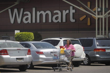 A shopper carts her purchases from a Wal-Mart store in Mexico City