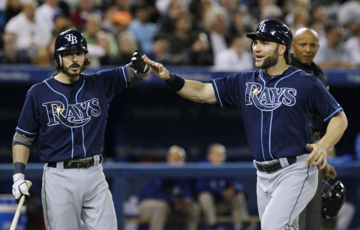 Utility infielder Will Rhymes (left) passed out during a game against the Red Sox Thursday night.