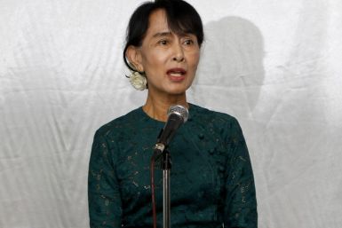 Myanmar's democracy leader Suu Kyi talks to the media during a news briefing in Yangon