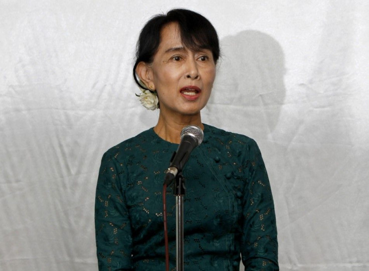 Myanmar's democracy leader Suu Kyi talks to the media during a news briefing in Yangon