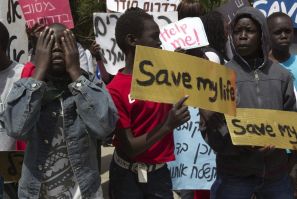 South Sudanese boys take part in a protest against their deportation outside the residence of Israeli Prime Minister Benjamin Netanyahu in Jerusalem April 1, 2012