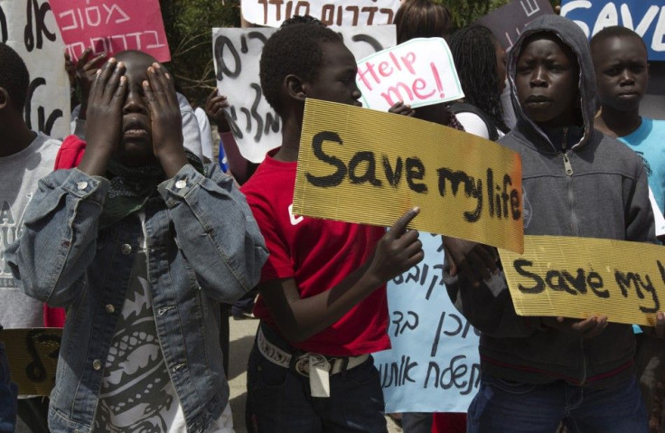 South Sudanese boys take part in a protest against their deportation outside the residence of Israeli Prime Minister Benjamin Netanyahu in Jerusalem April 1, 2012