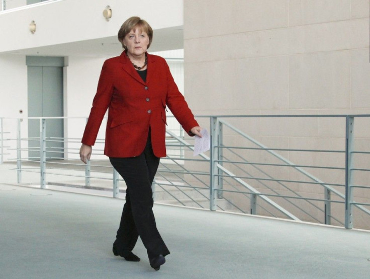 German Chancellor Merkel arrives to make a statement at the Chancellery in Berlin