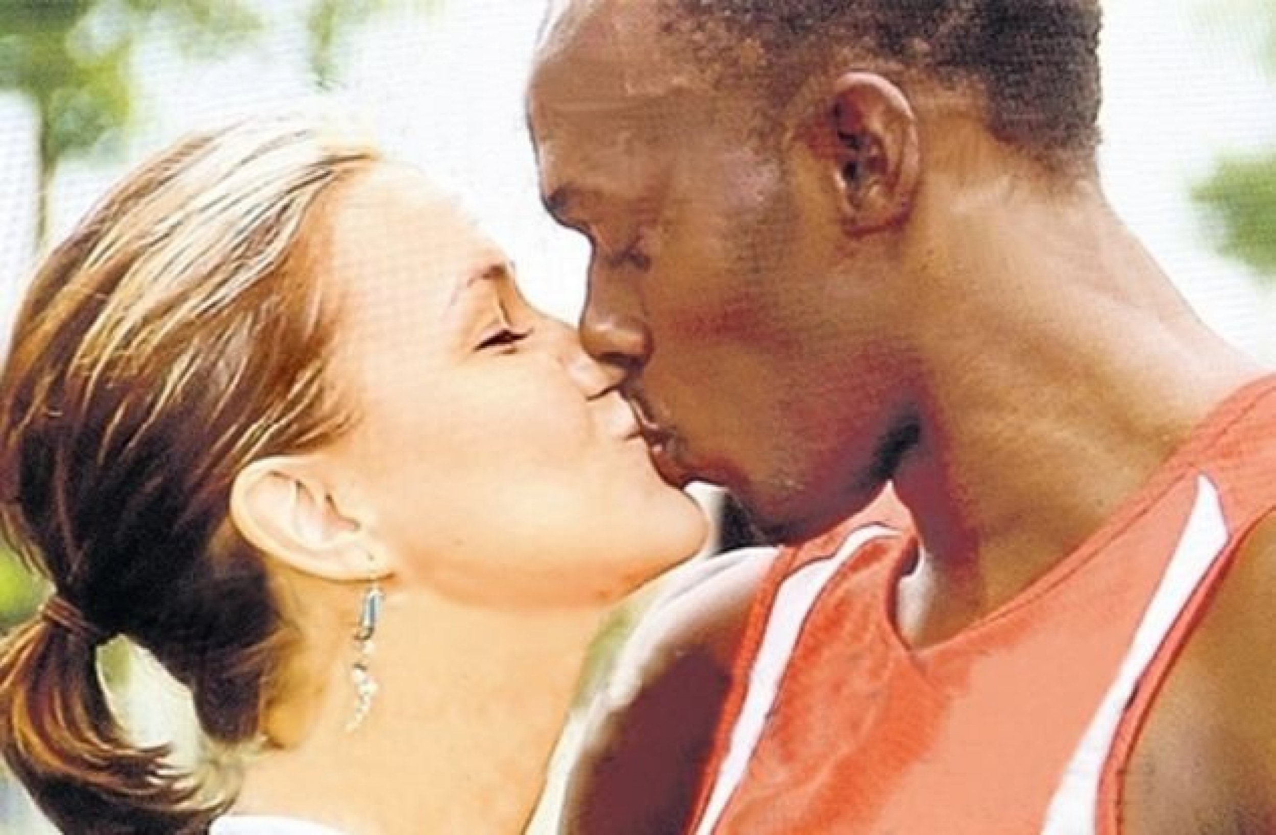 This photo of Slovak and Bolt kissing sparked racial anger from some in Jamaica.