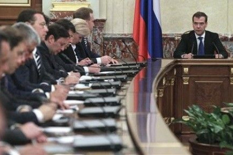 Russian Prime Minister Dmitry Medvedev (R) chairs a meeting of the new cabinet in Moscow&quot;s White House May 21, 2012.