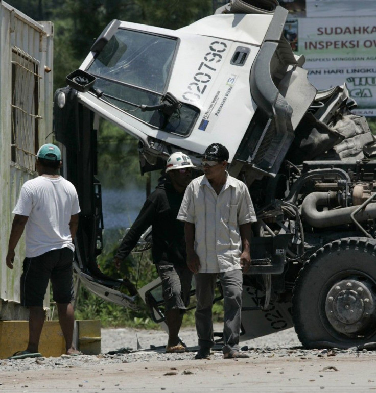 Striking Grasberg miners vandalize truck