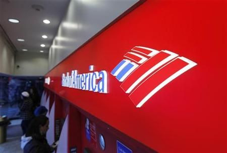 Customers use ATM machines inside of a Bank of America branch in Times Square in New York