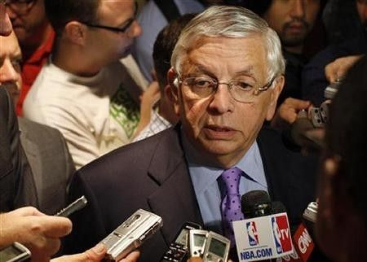 National Basketball Association commissioner David Stern (R) answers questions with deputy commissioner, Adam Silver to members of the media outside the Louvell hotel in New York