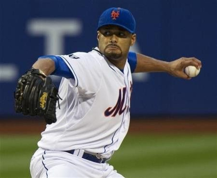 New York Mets starting pitcher Johan Santana throws a pitch to the St. Louis Cardinals in the first inning of their MLB National League game at CitiField in New York, June 1, 2012.