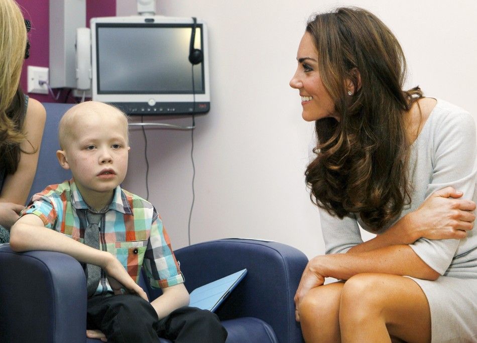 Britains Catherine, Duchess of Cambridge meets patient Fabian Bate, 9, at the new Oak Centre for Children and Young People at The Royal Marsden Hospital in Sutton, Southern England