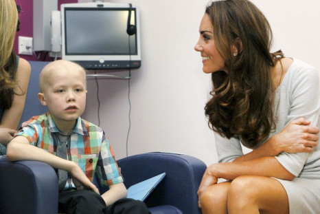 Britain's Catherine, Duchess of Cambridge meets patient Fabian Bate, 9, at the new Oak Centre for Children and Young People at The Royal Marsden Hospital in Sutton, Southern England
