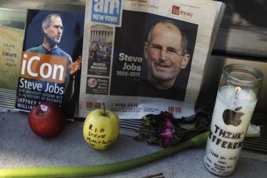 Items left at an impromptu shrine memorializing Steve Jobs are seen outside of Apple's upper west side store in New York