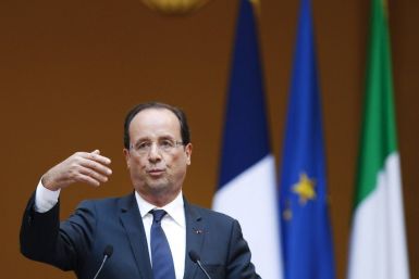 French President Francois Hollande gestures during a news conference with Italian Prime Minister Mario Monti at the Chigi palace in Rome