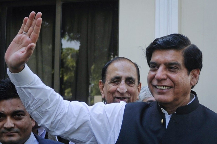 Pakistan&#039;s Prime Minister-elect Raja Pervez Ashraf waves to media in Islamabad