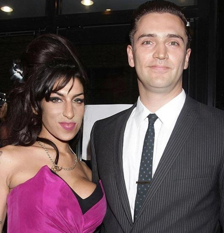 Amy Winehouse and Reginald &#039;Reg&#039; Traviss