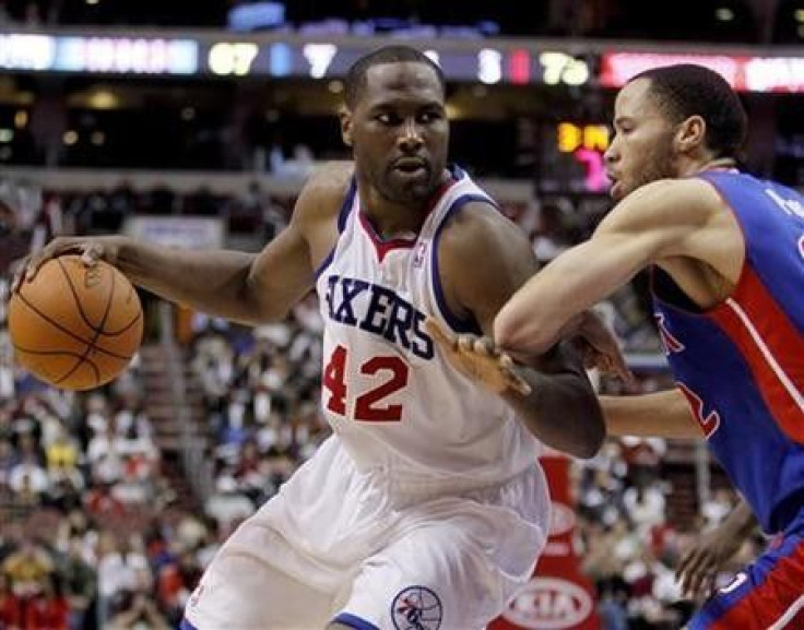 Philadelphia 76ers forward Elton Brand (42) drives on the Detroit Pistons forward Tayshaun Prince (R) during the third quarter of NBA basketball game action in Philadelphia, Pennsylvania, April 13, 2011.