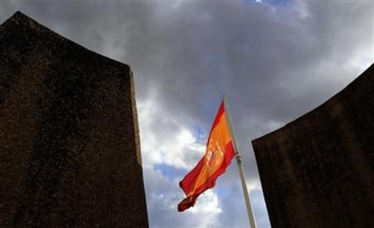 A Spanish flag flutters over the Colon square in central Madrid