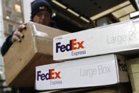 FedEx boxes unloaded off delivery truck in New York after FedEx Corp. reported quarterly profit and revenue data that missed Wall Street estimates