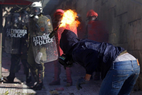 Masked youth throws petrol bomb at police in Athens