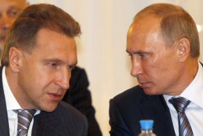 Russia&#039;s Prime Minister Putin speaks to First Deputy Prime Minister Shuvalov during a meeting with government leaders from Eurasian Economic Community countries in St.Petersburg