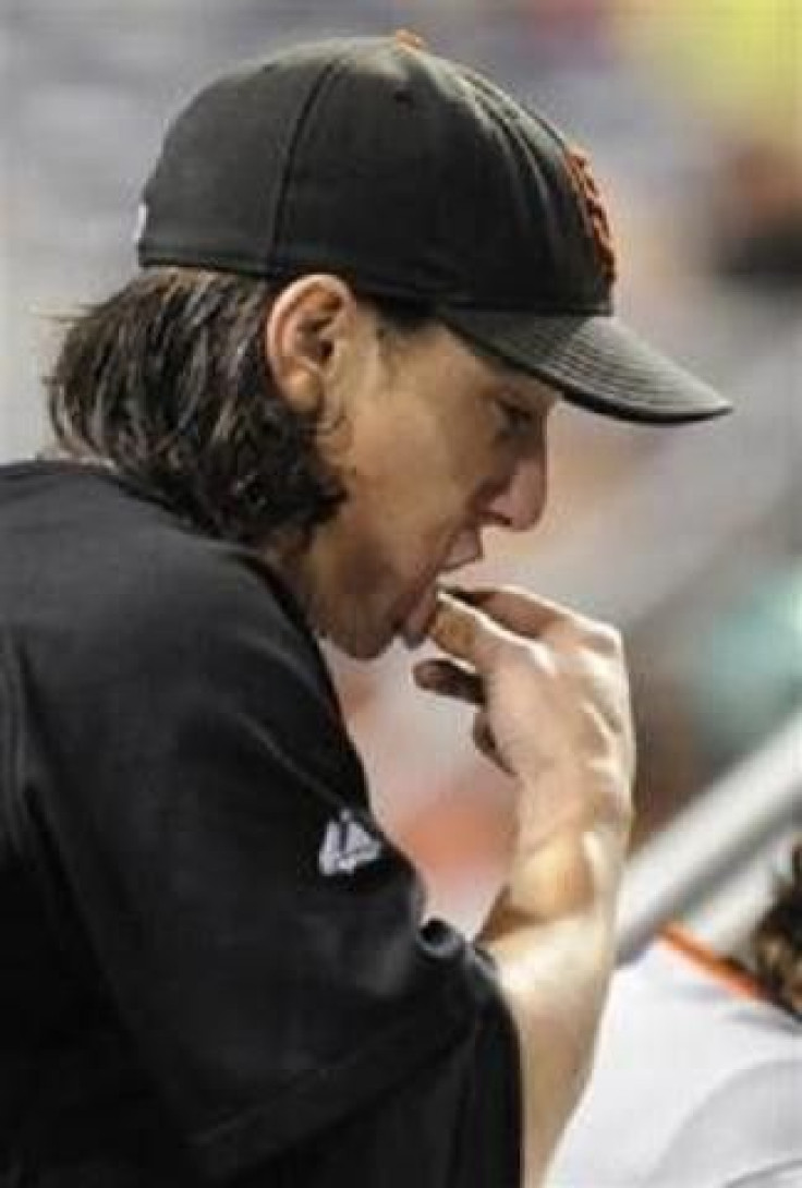 San Francisco starting pitcher Tim Lincecum (55) puts some chewing tobacco in his mouth during the 11th inning against the Pittsburgh Pirates in their MLB National League baseball game in Pittsburgh, Pennsylvania