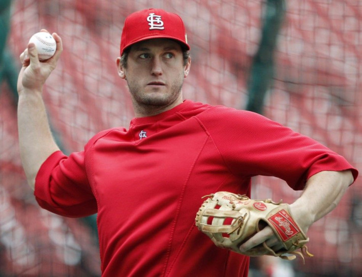 Cardinals&#039; Freese throws during practice before their MLB World Series baseball game in St. Louis