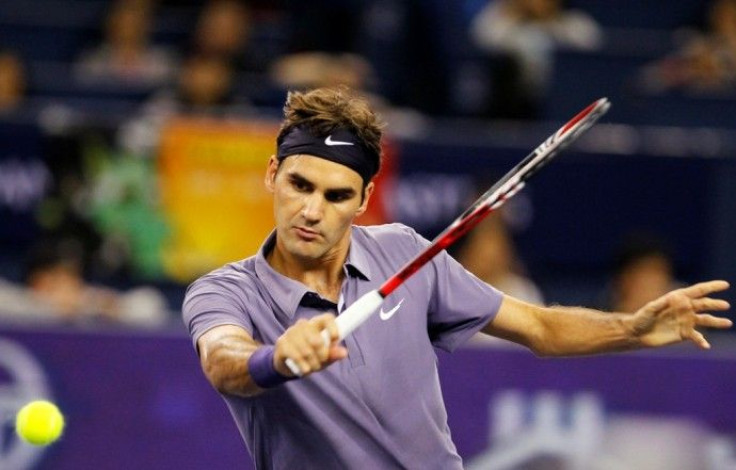 Roger Federer of Switzerland hits a return during his match against John Isner of the U.S. at the Shanghai Masters tennis tournament 