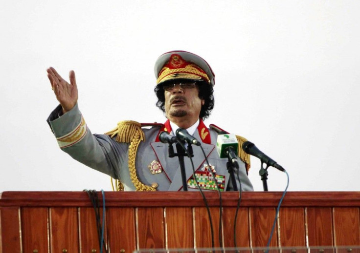 Libyan leader Moammar Gadhafi speaks during a ceremony to mark the 40th anniversary of the evacuation of the American military bases in the country, in Tripoli